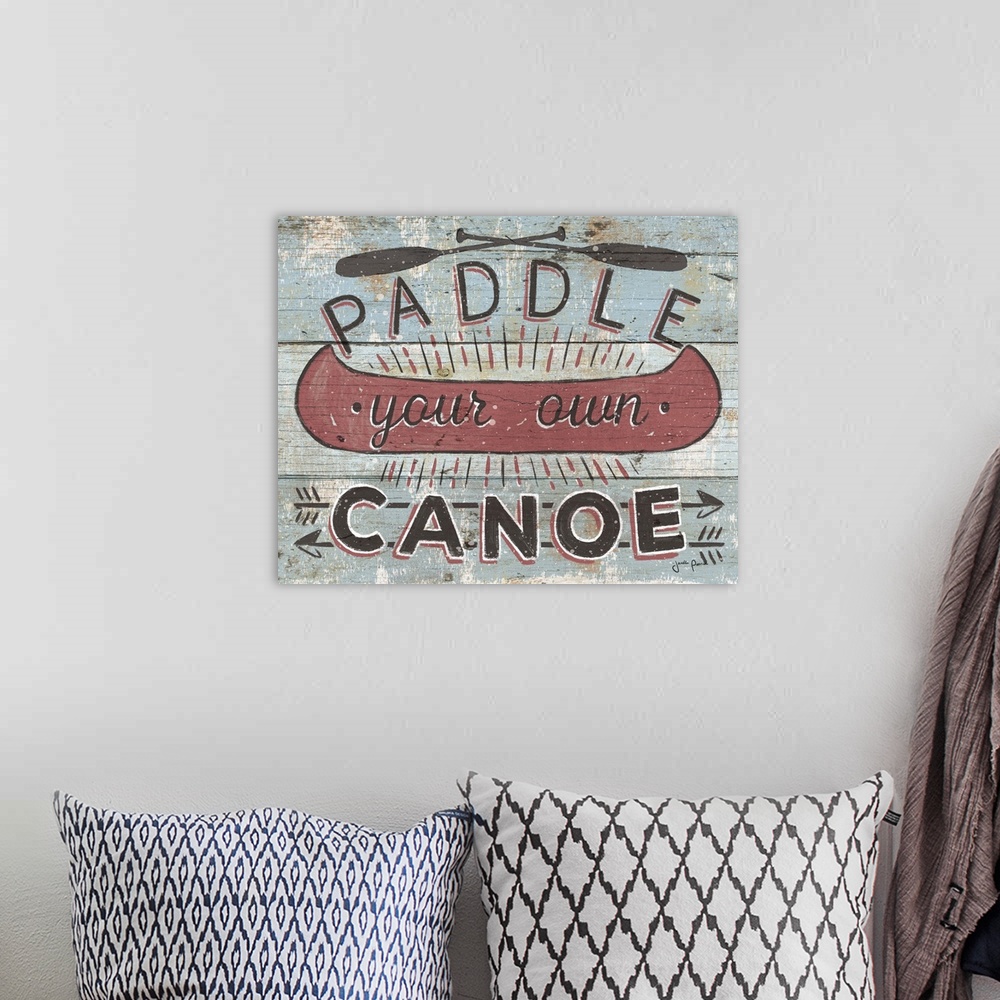 A bohemian room featuring Vintage style image on a wooden board background of a canoe and "Paddle your own Canoe."