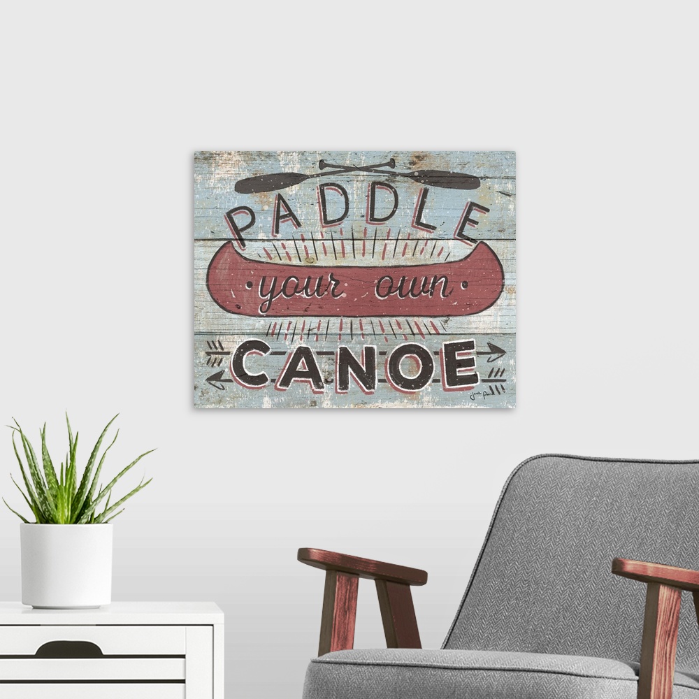 A modern room featuring Vintage style image on a wooden board background of a canoe and "Paddle your own Canoe."