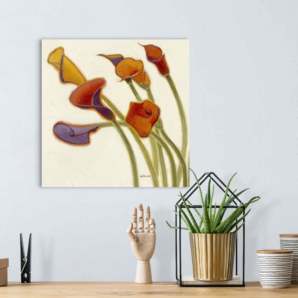 A bohemian room featuring Big, square decorative painting of a group of colorful calla lily's with stems extending upward f...