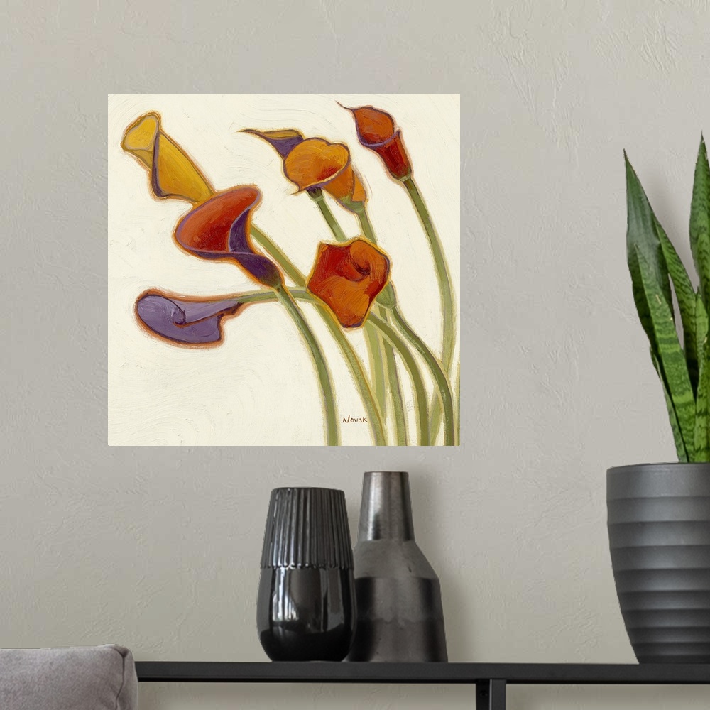 A modern room featuring Big, square decorative painting of a group of colorful calla lily's with stems extending upward f...