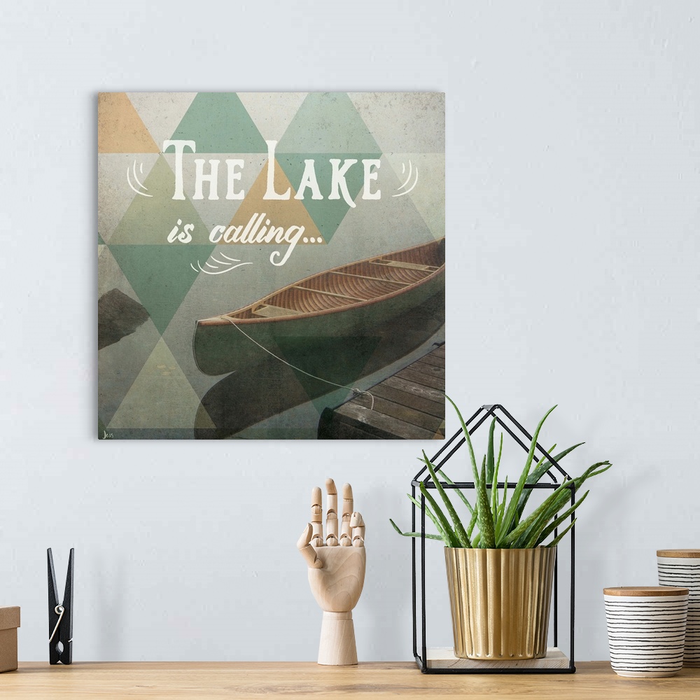 A bohemian room featuring Typography art against a photograph of a canoe on a foggy lake.