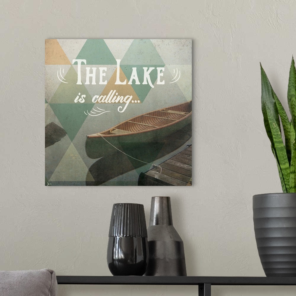 A modern room featuring Typography art against a photograph of a canoe on a foggy lake.