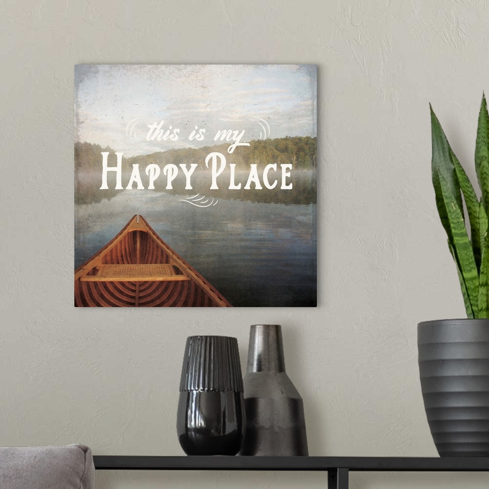 A modern room featuring "This is My Happy Place" written over an illustration of a canoe on the lake.