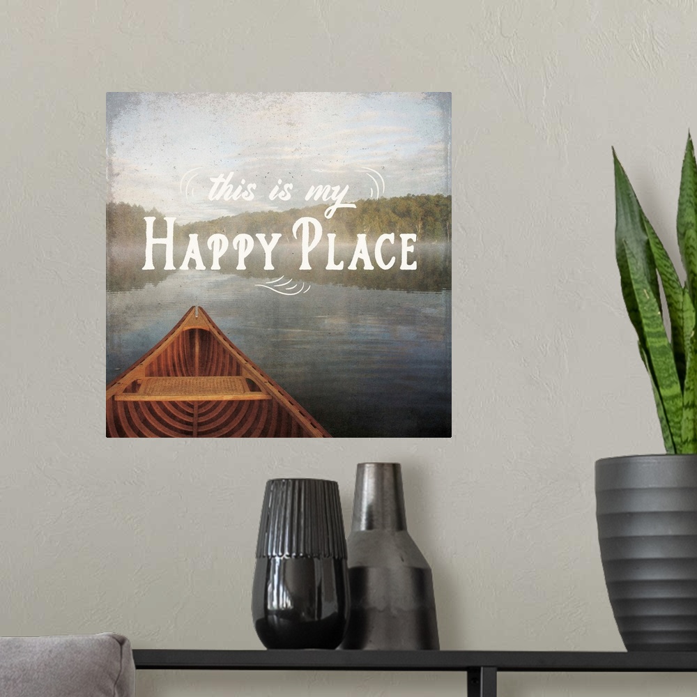 A modern room featuring "This is My Happy Place" written over an illustration of a canoe on the lake.