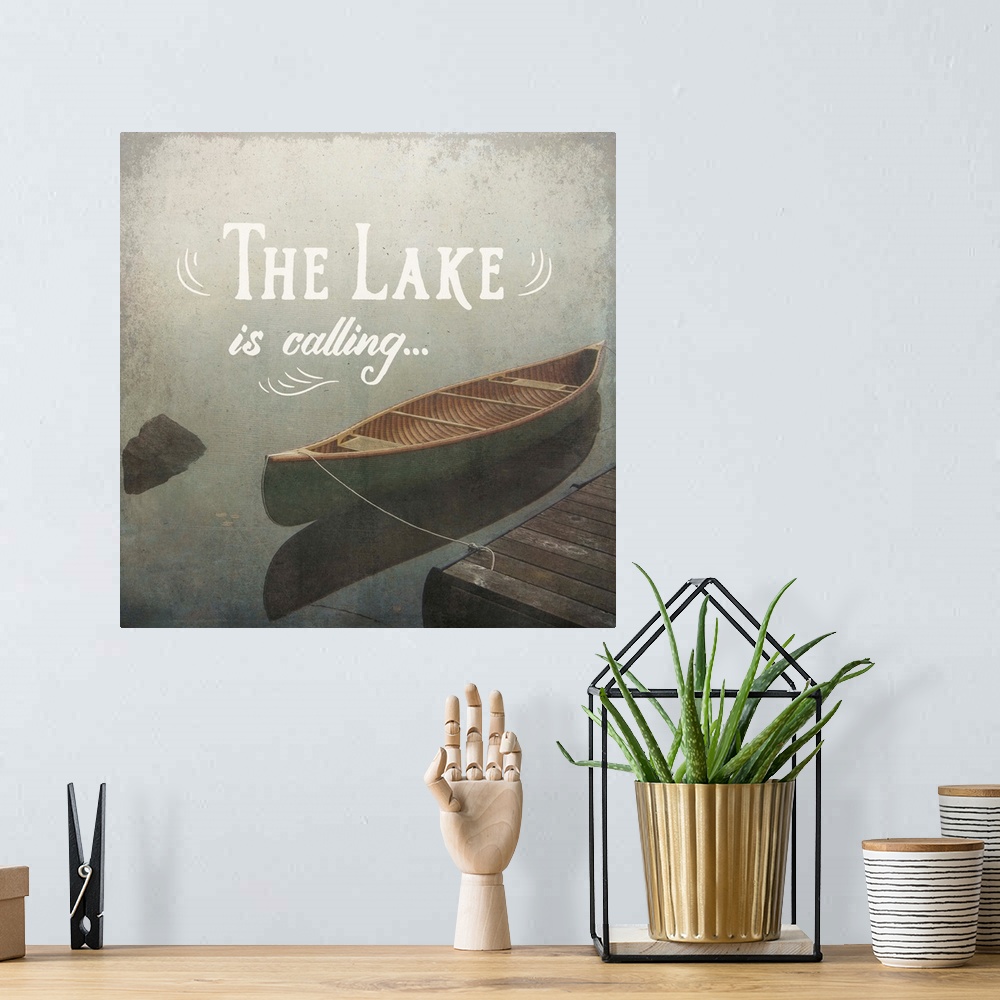 A bohemian room featuring "The Lake is Calling" written over an illustration of a docked canoe on the lake.
