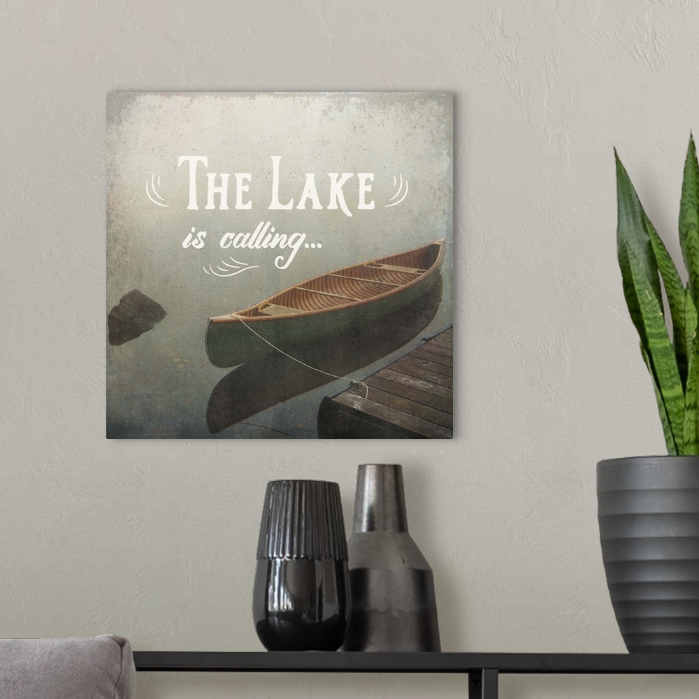 A modern room featuring "The Lake is Calling" written over an illustration of a docked canoe on the lake.