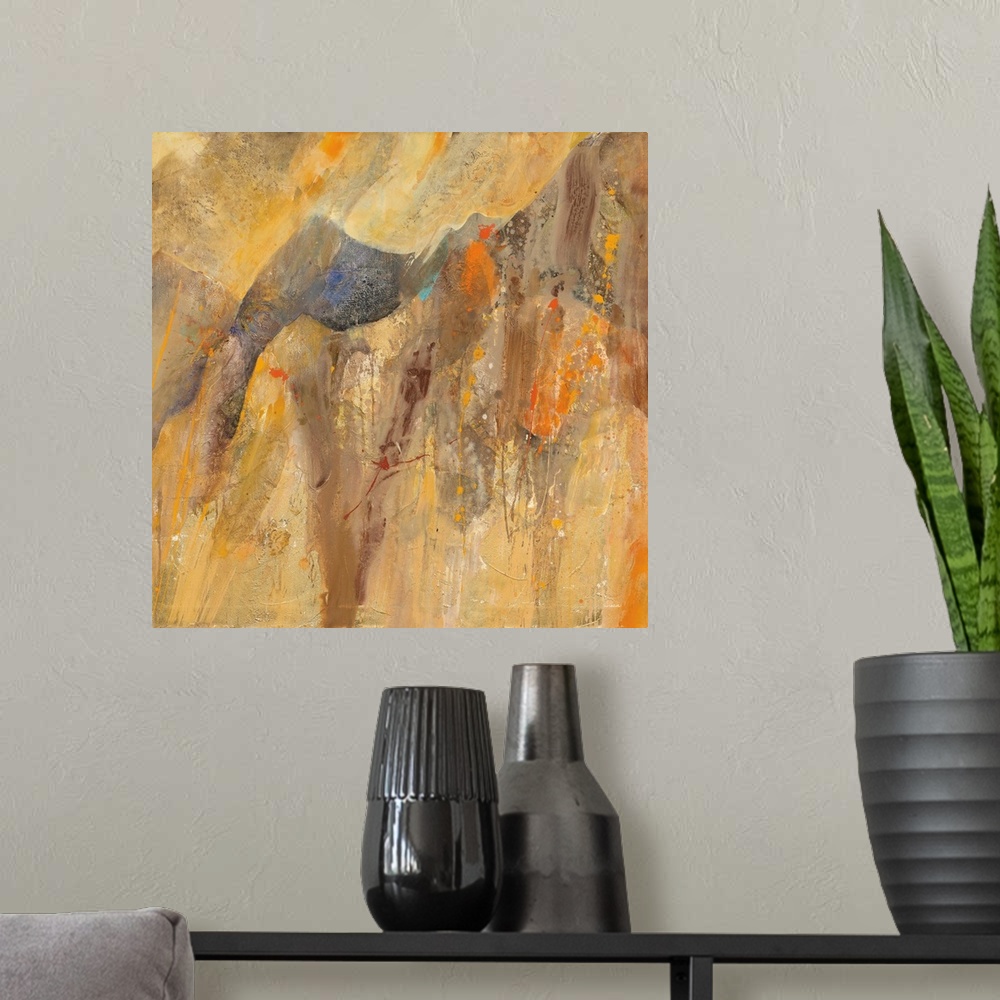 A modern room featuring Square abstract painting with brown, orange, cream, and yellow hues resembling a canyon with smal...