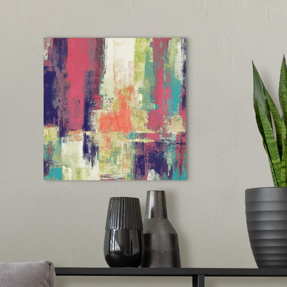 A modern room featuring Square abstract painting with bold colors layered on top of each other.
