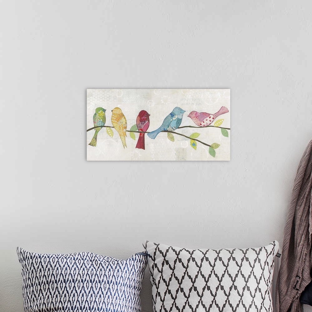 A bohemian room featuring Colorfully patterned birds perched on a tree branch against a neutral rustic background.