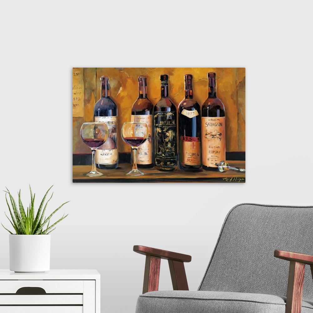 A modern room featuring Landscape wall painting of five bottles of red wine with two full wine glasses sitting on a count...