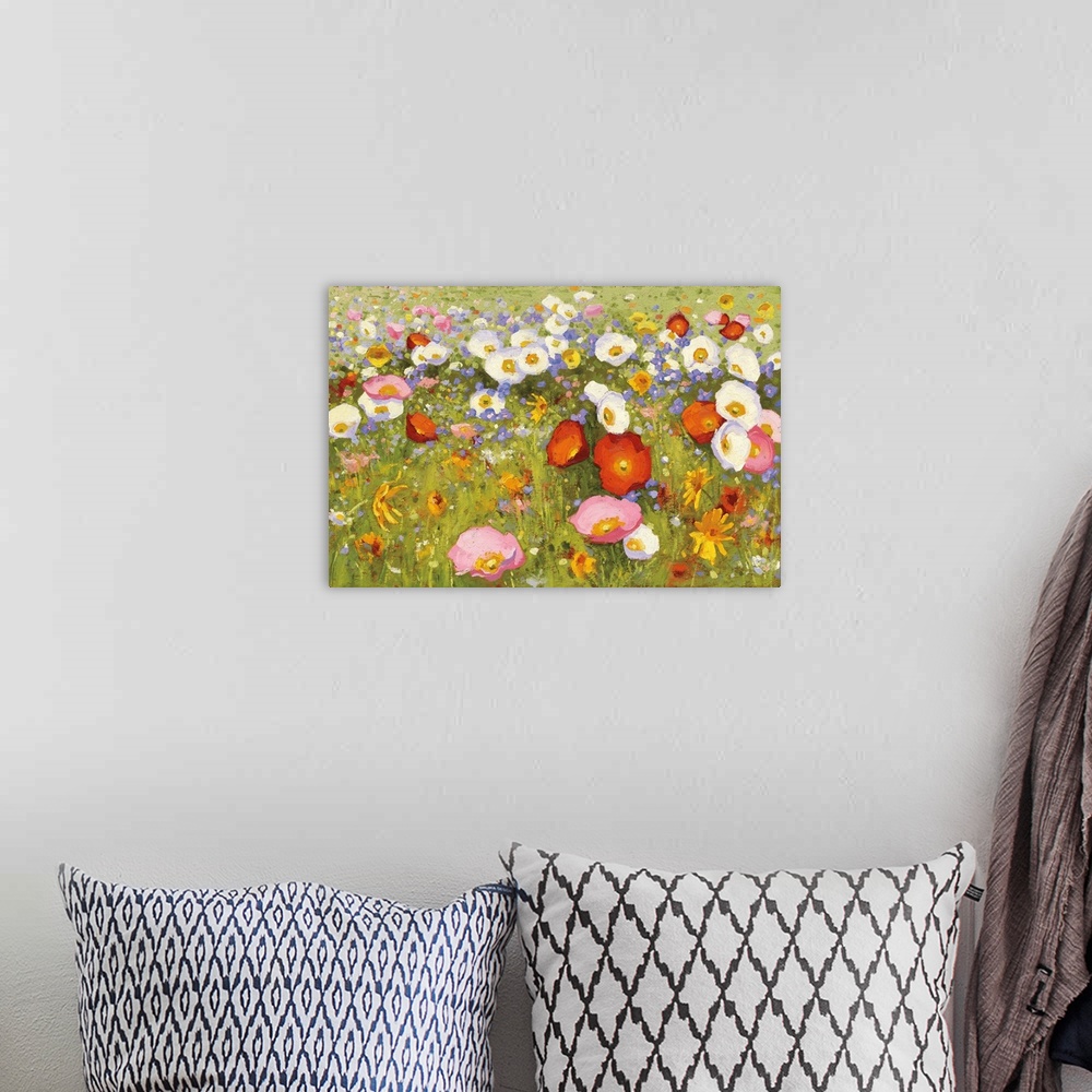 A bohemian room featuring Contemporary artwork of a field of blooming flowers in pink, red, and white.