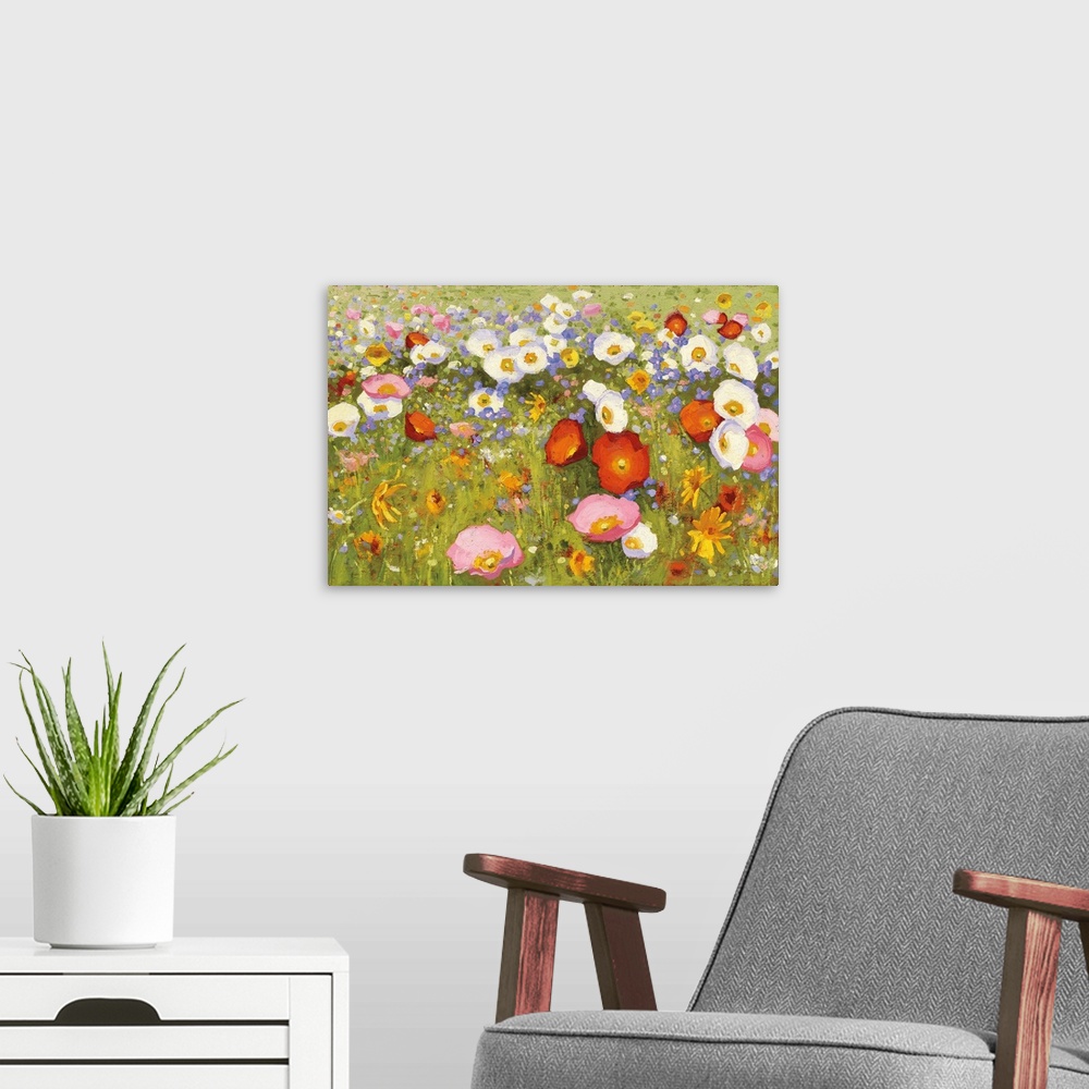 A modern room featuring Contemporary artwork of a field of blooming flowers in pink, red, and white.
