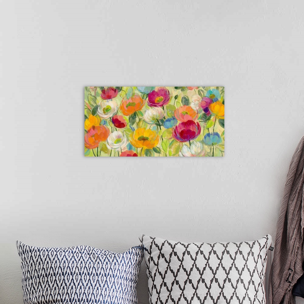 A bohemian room featuring Painting of several colorful flowers in a garden.