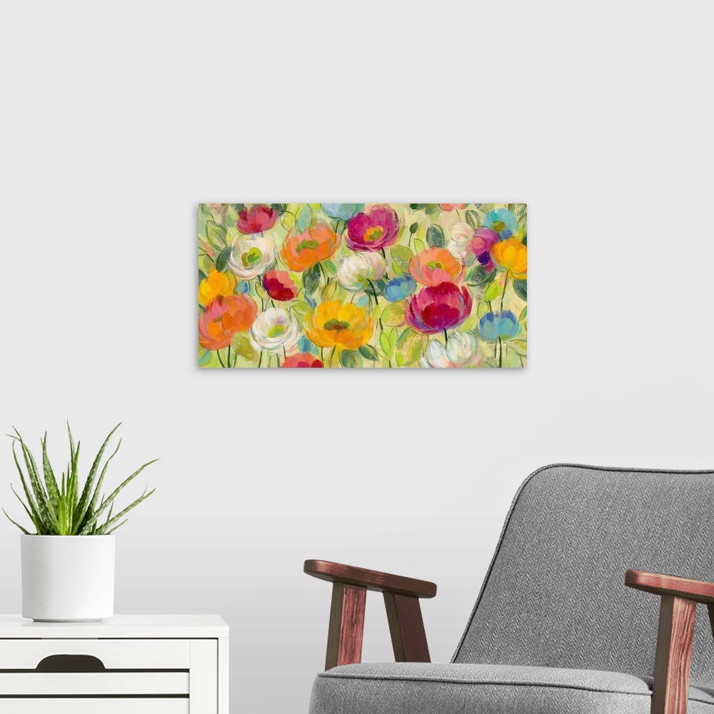 A modern room featuring Painting of several colorful flowers in a garden.