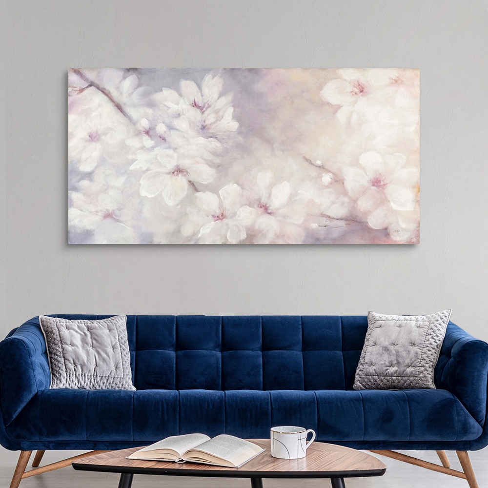 A modern room featuring Large abstract watercolor painting of white cherry blossoms on a soft purple, pink, and orange ba...