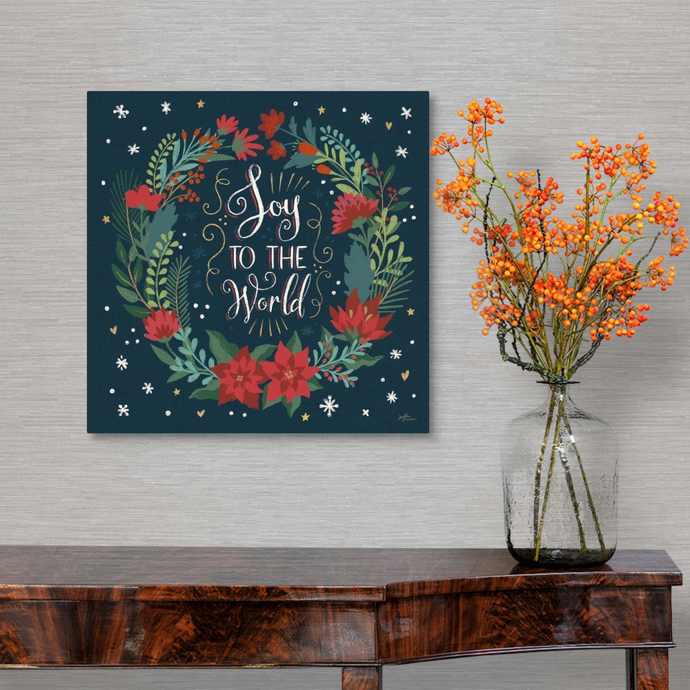 A traditional room featuring Decorative artwork of a wreath surrounding the text "Joy To the World"  on a dark navy background.