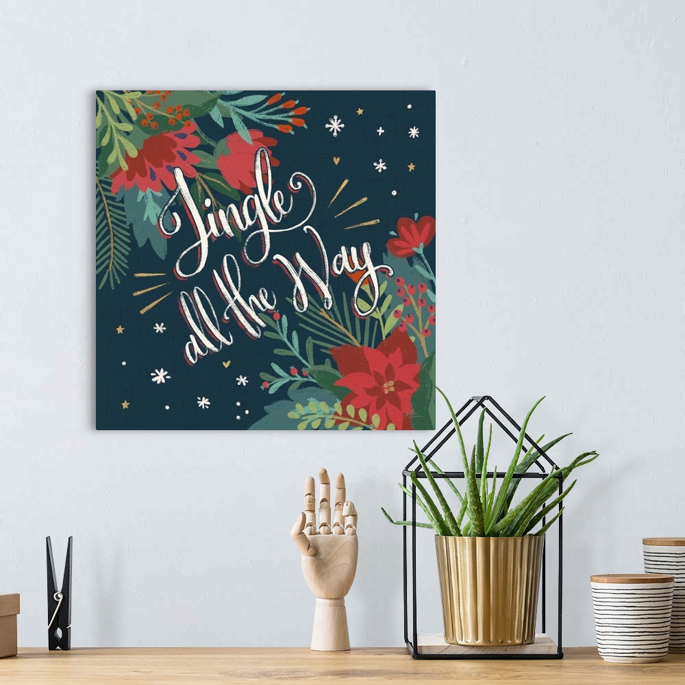 A bohemian room featuring Decorative artwork of red flowers and leaves with the text "Jingle all the Way" on a dark navy ba...