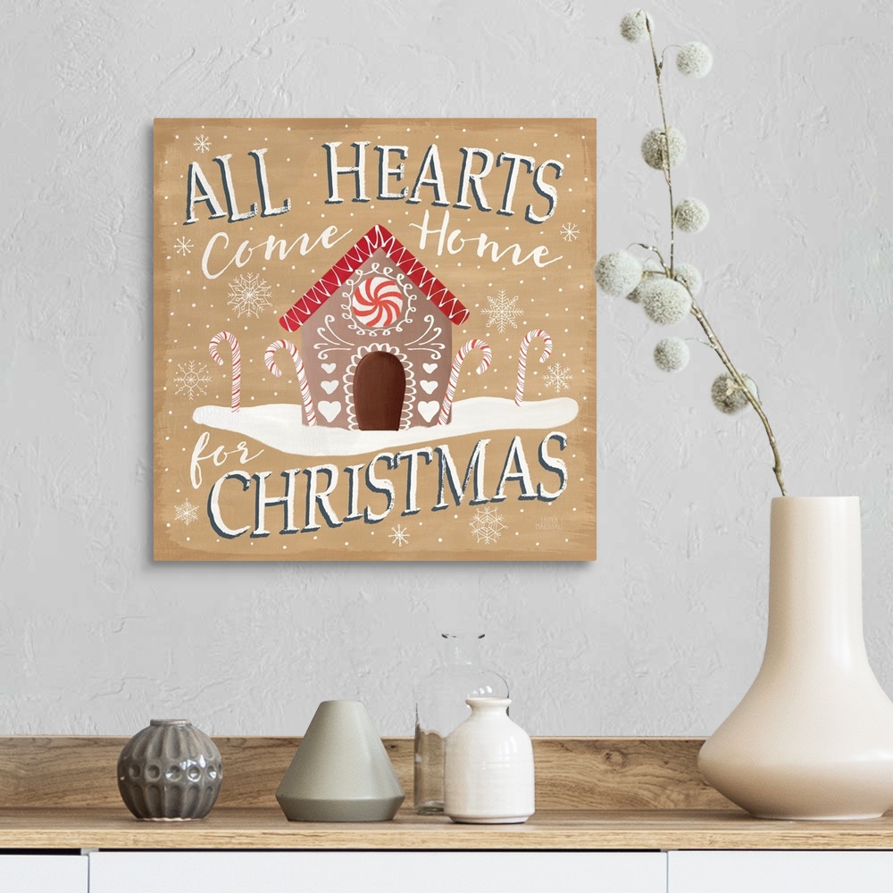 A farmhouse room featuring Square decorative artwork of a gingerbread house with the text "All Hearts Come Home for Christma...
