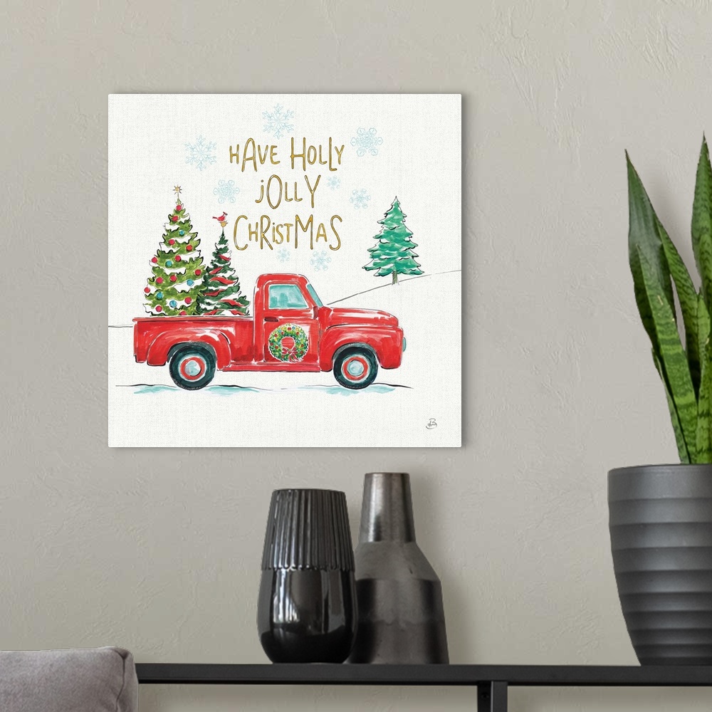 A modern room featuring Decorative Christmas themed artwork with the phrase "Have a holly jolly Christmas" written at the...