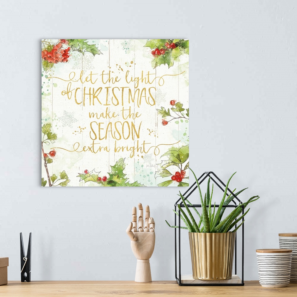 A bohemian room featuring Decorative artwork of holly with the words "let the light of Christmas make the Season extra brig...