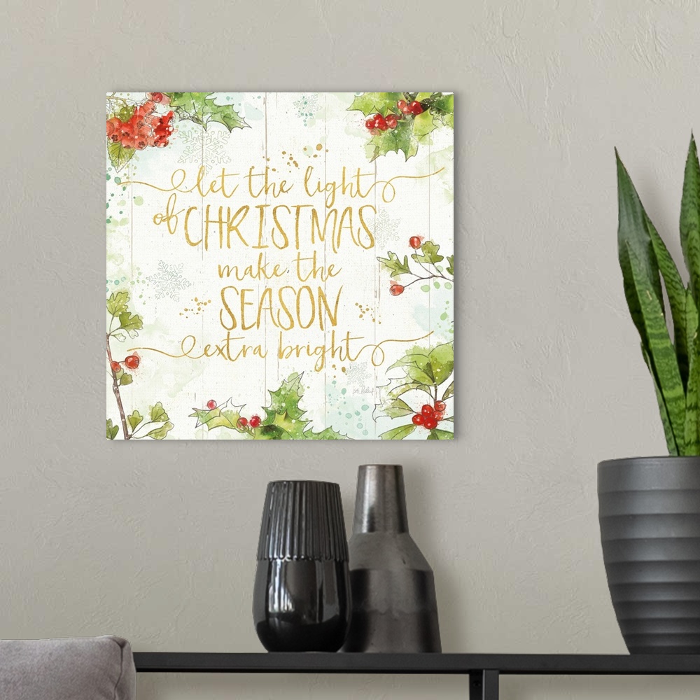 A modern room featuring Decorative artwork of holly with the words "let the light of Christmas make the Season extra brig...