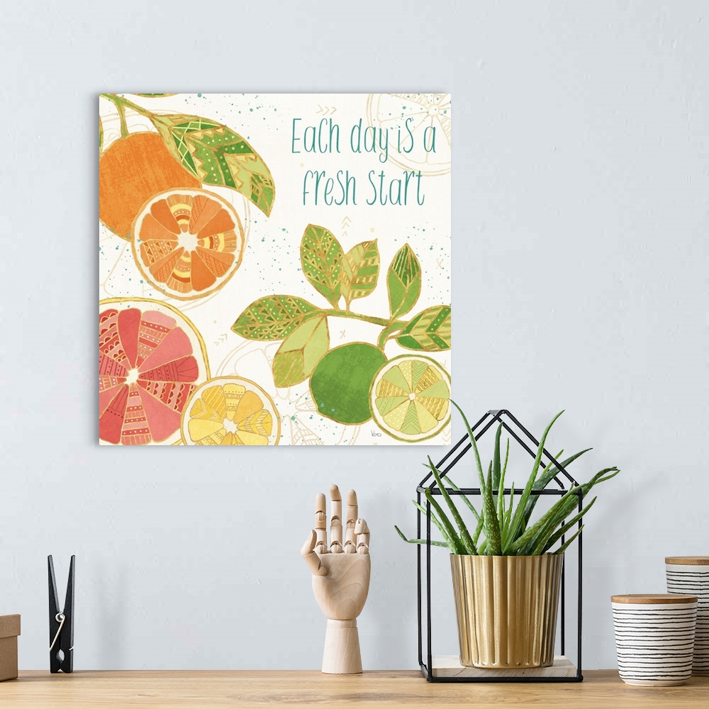 A bohemian room featuring Decorative colorful artwork of sliced fruits with geometric designs and the phrase, 'Each day is ...