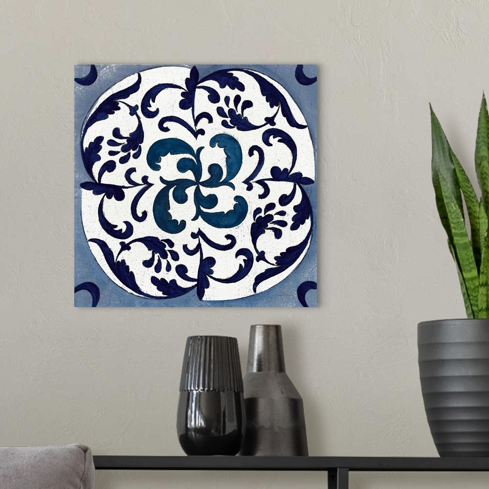 A modern room featuring Square abstract painting of a symmetric indigo and white tile-like design.