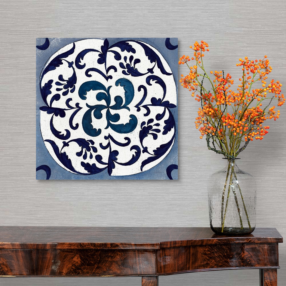 A traditional room featuring Square abstract painting of a symmetric indigo and white tile-like design.