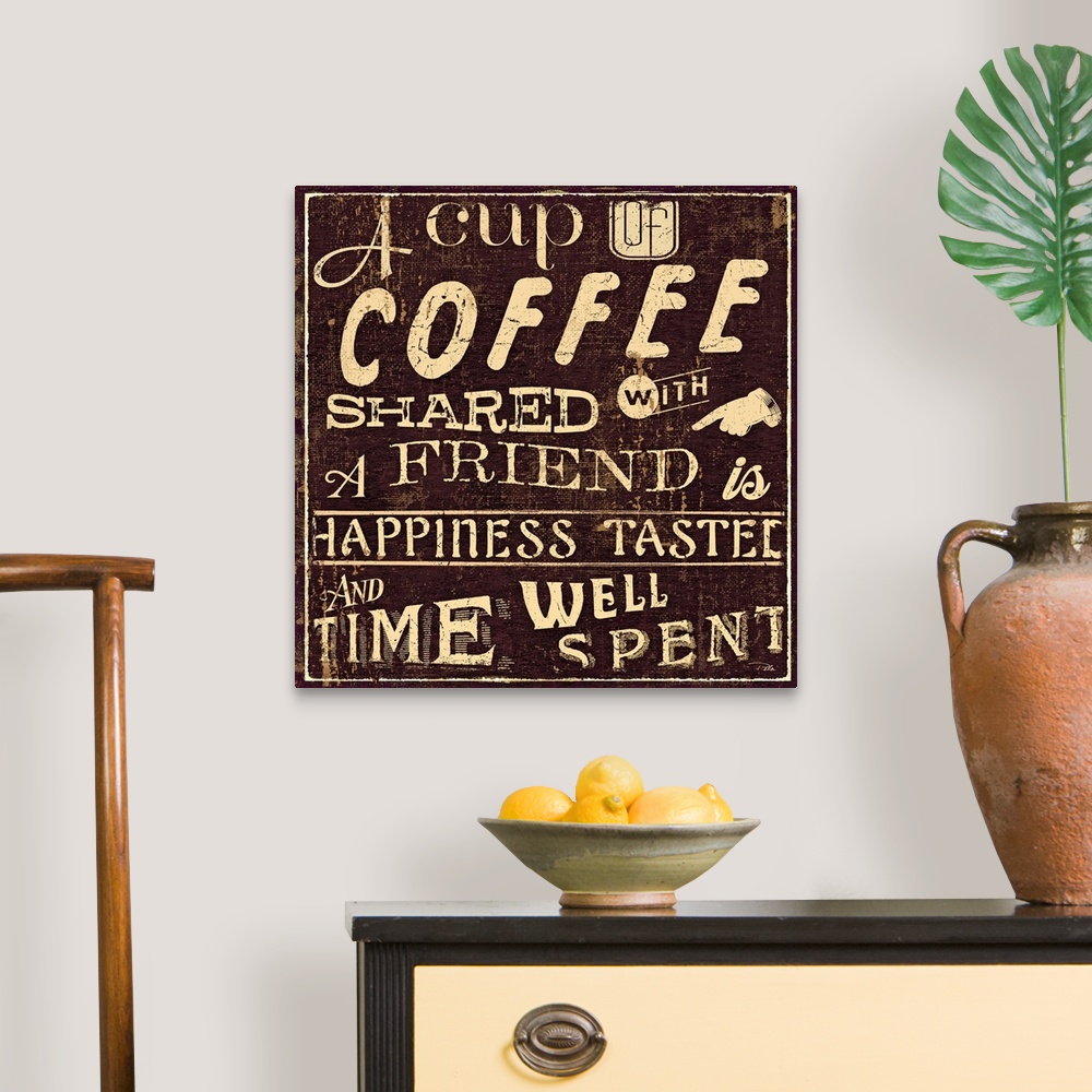 A traditional room featuring Vintage cafo artwork with the text "A cup of coffee shared with a friend is happiness tasted and ...