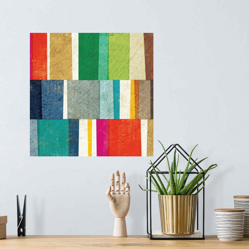 A bohemian room featuring Brightly colored color block abstract.