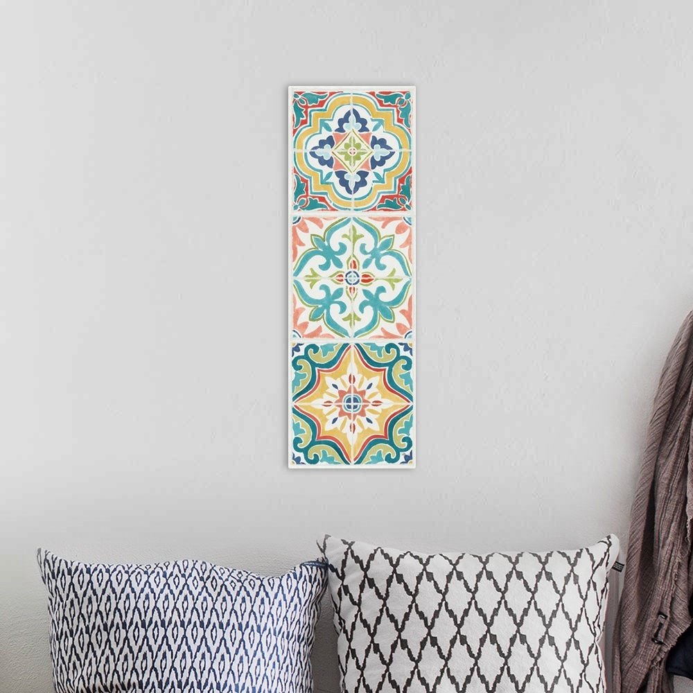 A bohemian room featuring Vertical artwork of square floral tile designs in cool colors of blue, green and red.