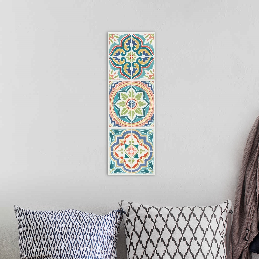 A bohemian room featuring Vertical artwork of square floral tile designs in cool colors of blue, green and red.