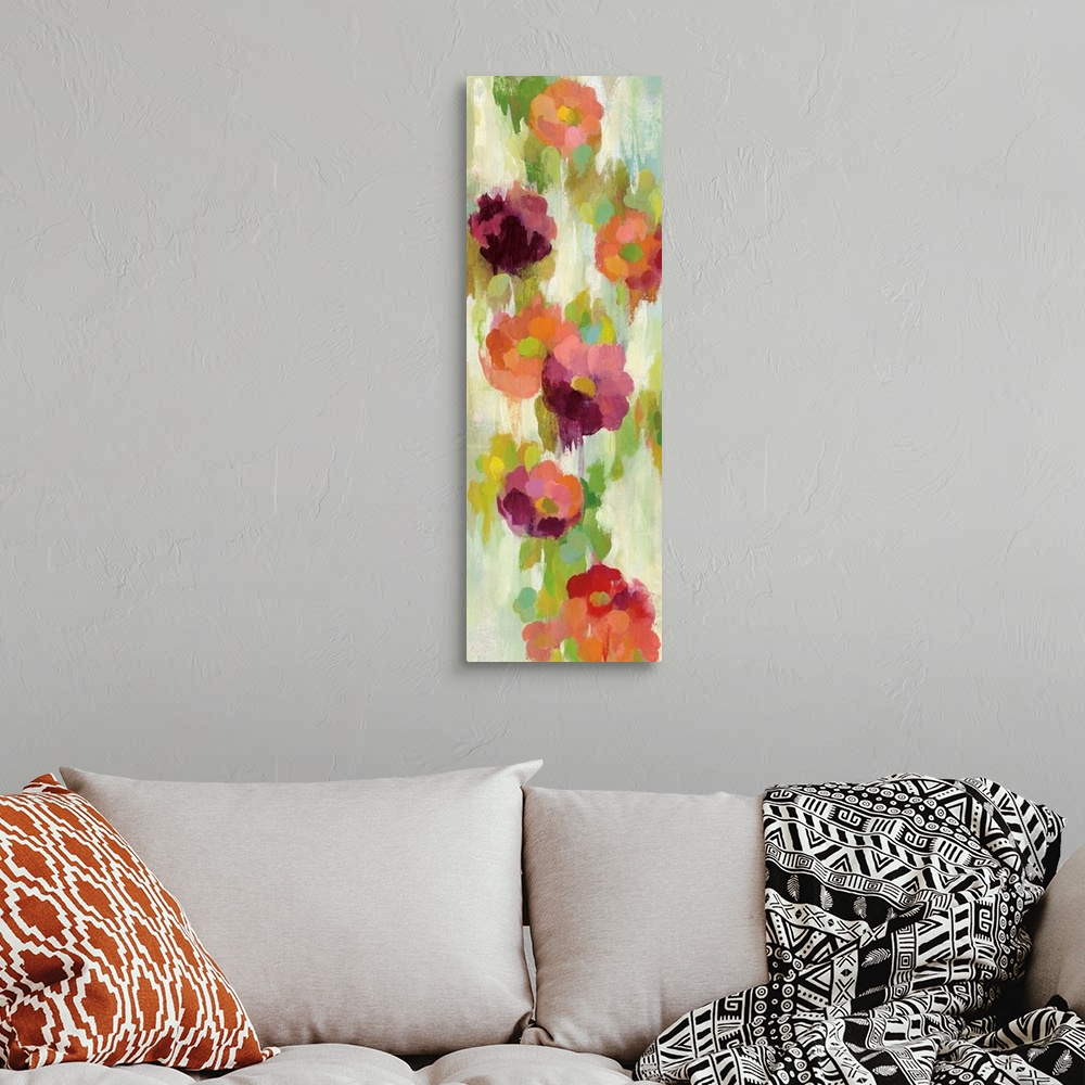 A bohemian room featuring Contemporary vertical painting of several flowers in red and purple.