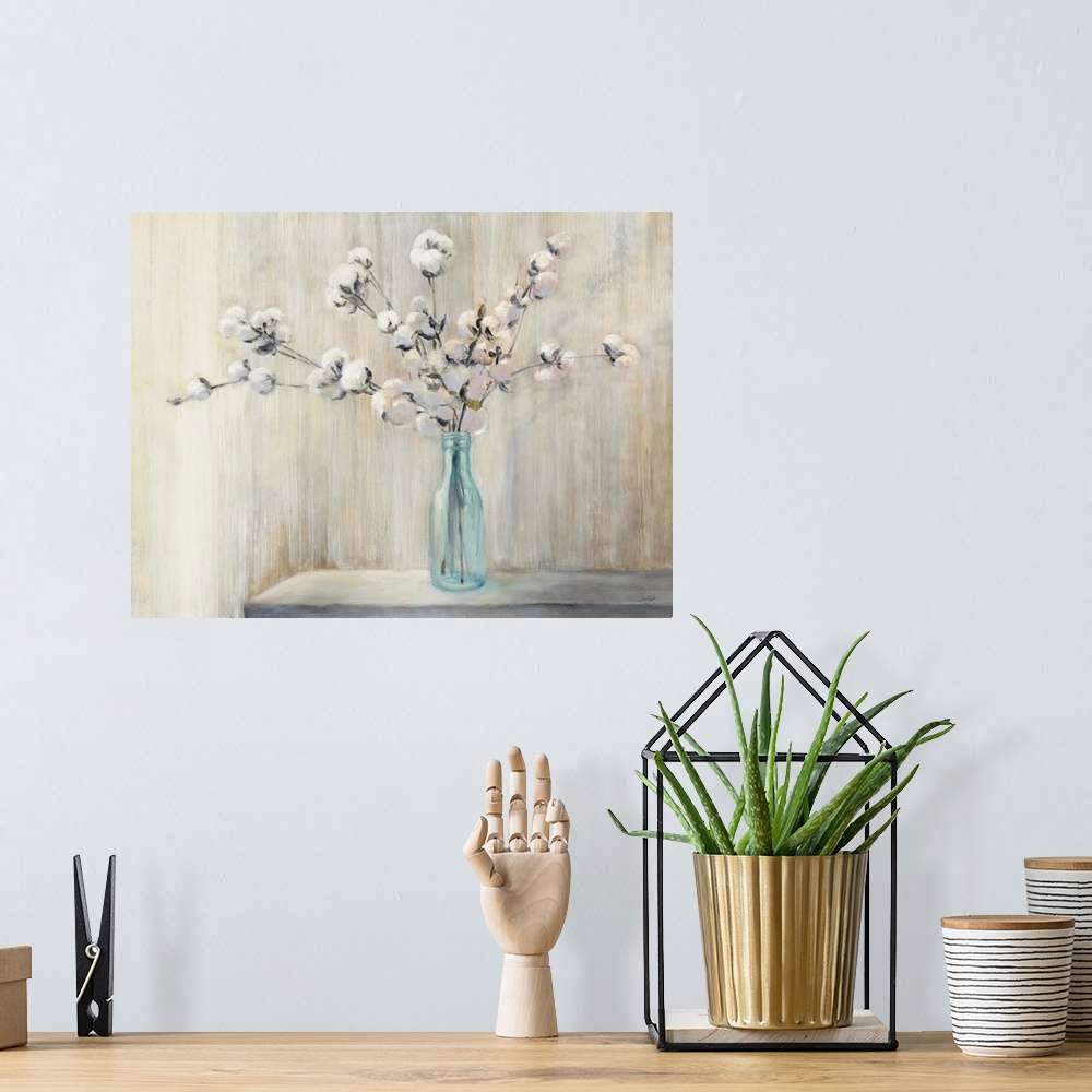 A bohemian room featuring Still life painting of a cotton bouquet in a glass bottle with a neutral colored background.