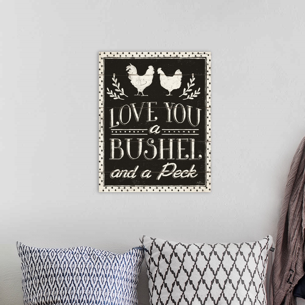 A bohemian room featuring Decorative country art featuring the words, 'Love You a bushel and a peck'.