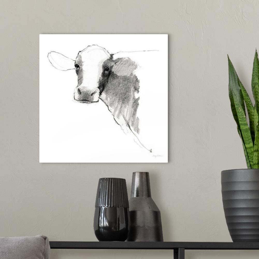 A modern room featuring Black and white illustration of a cow on a solid white, square background.