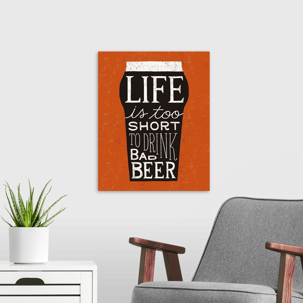 A modern room featuring Fun typography artwork in the shape of a beer glass.