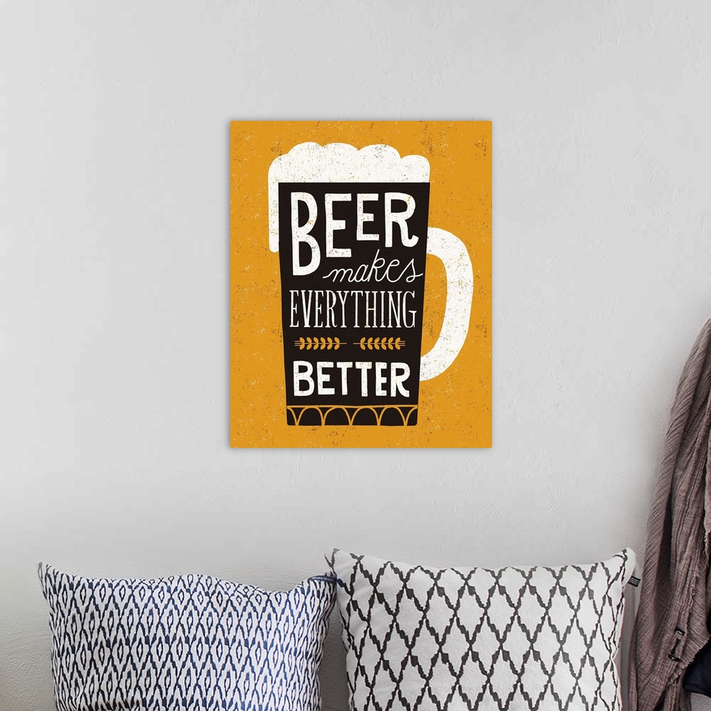 A bohemian room featuring Fun typography artwork in the shape of a beer mug.