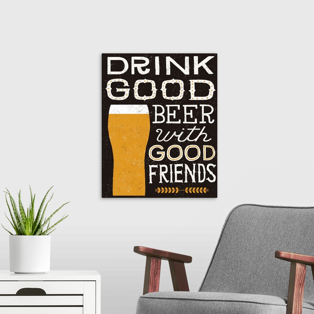 A modern room featuring Beer typography artwork on black with a glass.