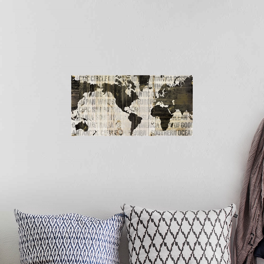 A bohemian room featuring Contemporary artwork of a world map in earth tones and covered in a faded text.