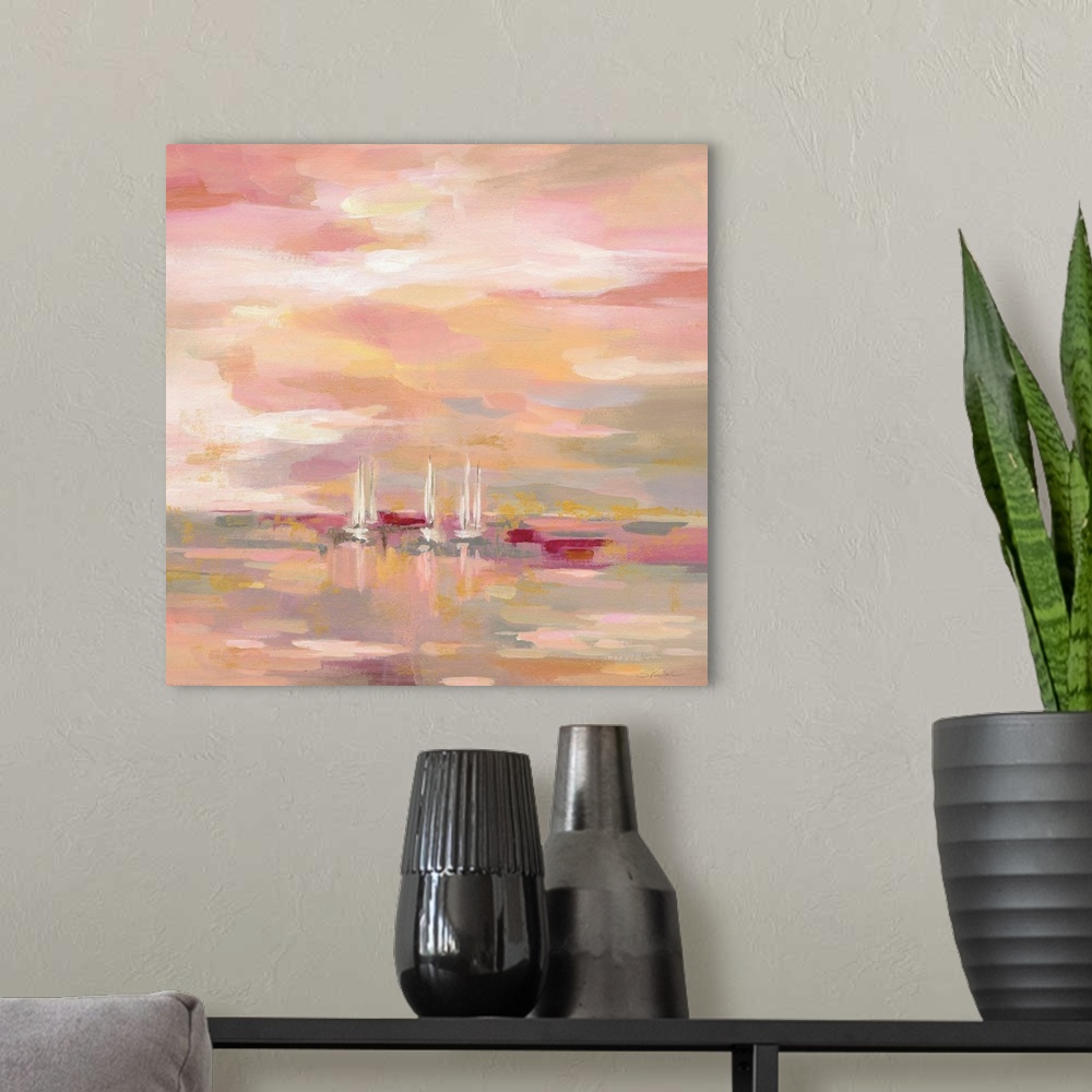 A modern room featuring A square painting of sailboats in the ocean in warm shades of pink and yellow.