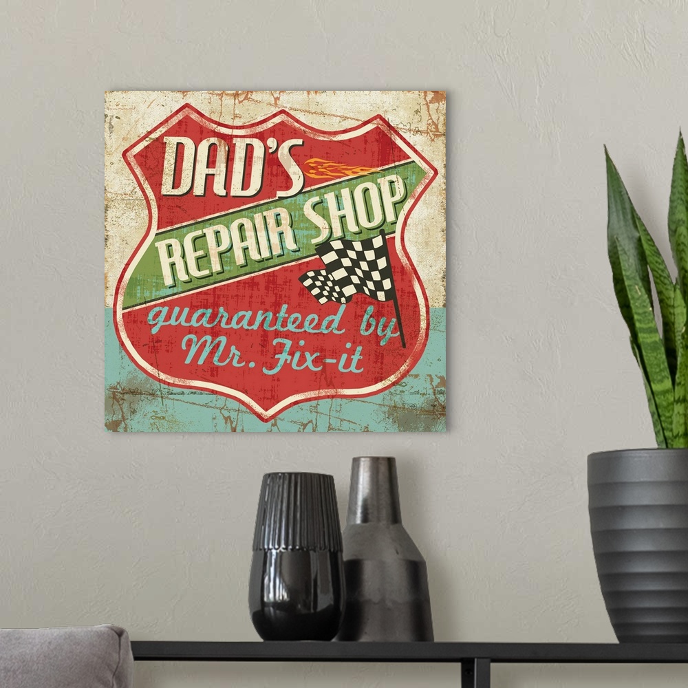 A modern room featuring Weathered sign for "Dad's Repair Shop" in a shield shape with a checkered flag.
