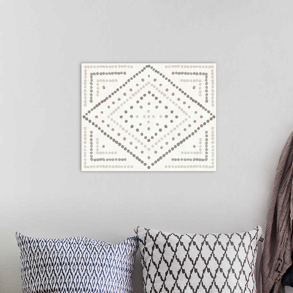 A bohemian room featuring Horizontal artwork of a diamond made of small dots in shades of grey.