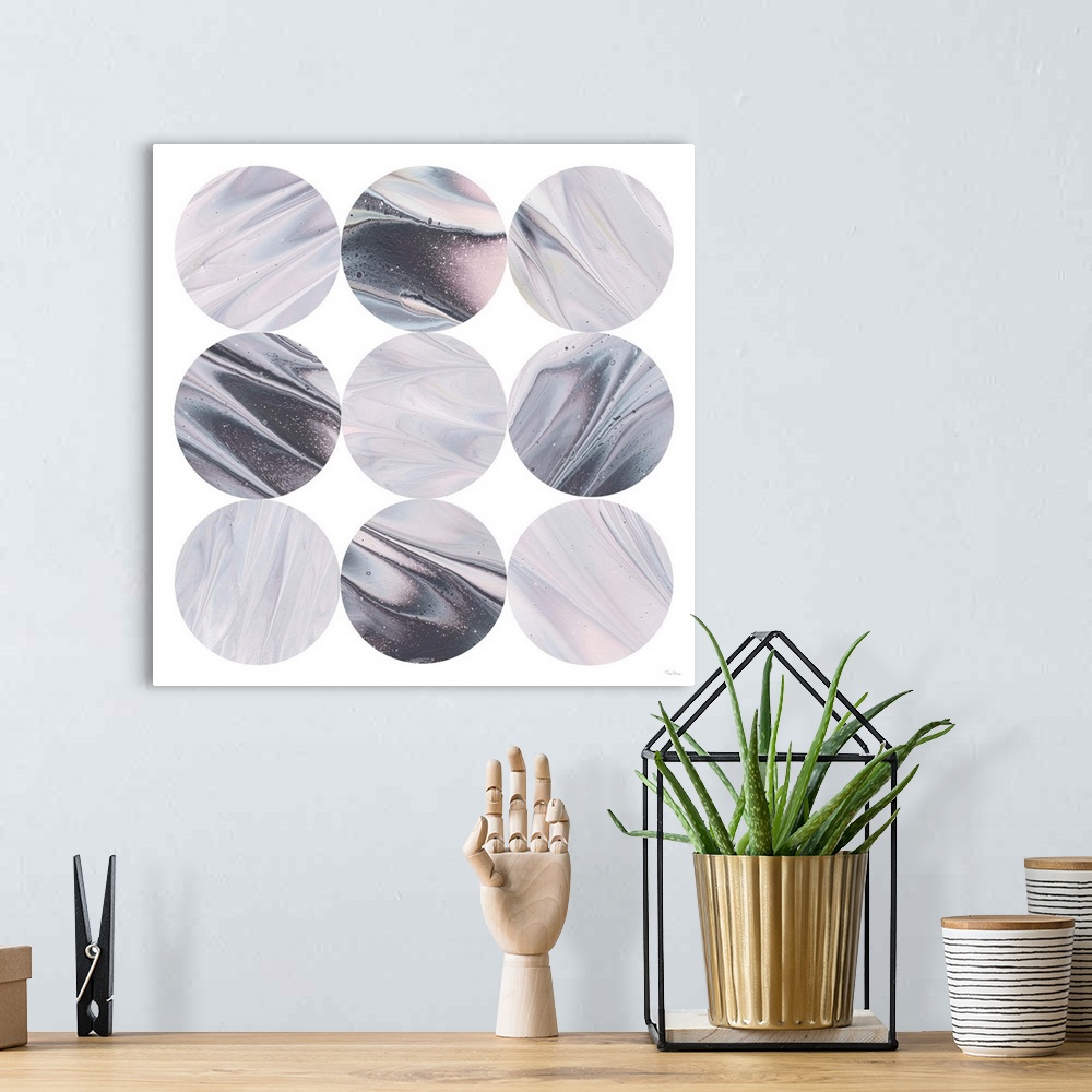 A bohemian room featuring Square geometric art of purple, blue, black, and pink marble designed circles stacked in rows on ...