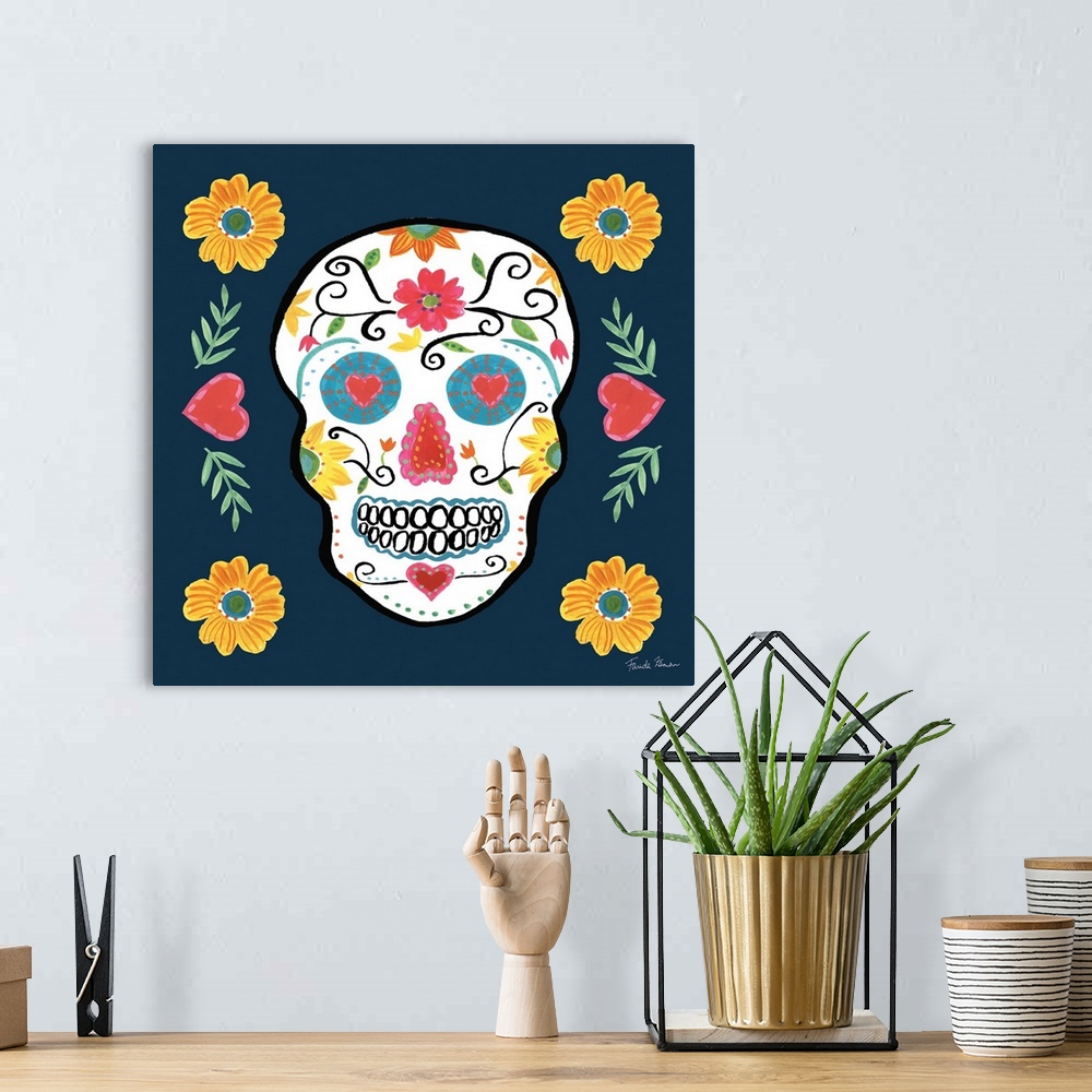 A bohemian room featuring Decorative artwork of a sugar skull over a blue background adorned with floral designs.