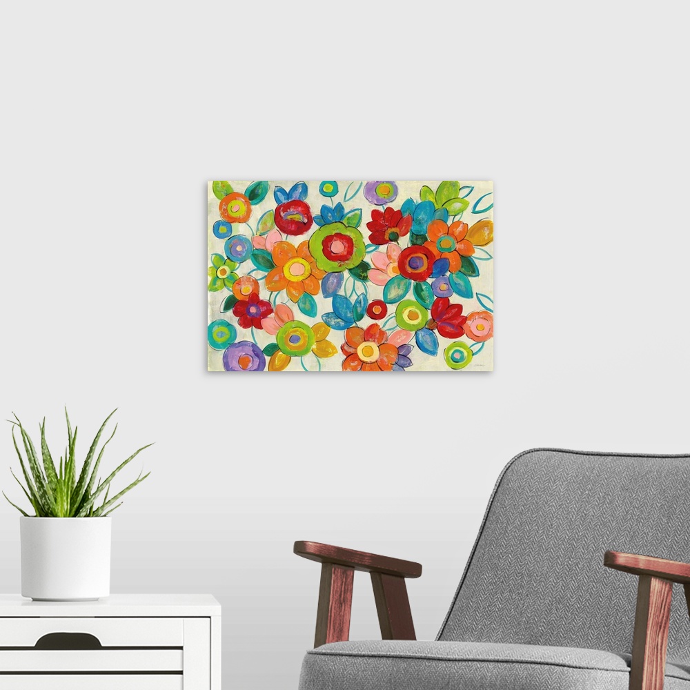 A modern room featuring Large abstract painting of bright flowers on a neutral background.