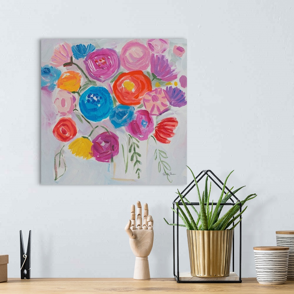 A bohemian room featuring A square modern painting of bright colorful flowers in in a vase.