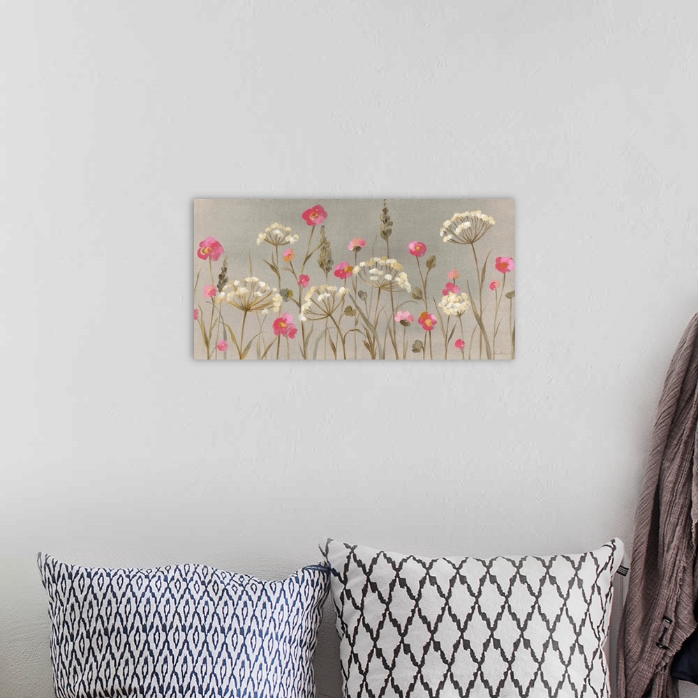 A bohemian room featuring A vertical painting of a display of wildflowers in white and pink on a gray backdrop.