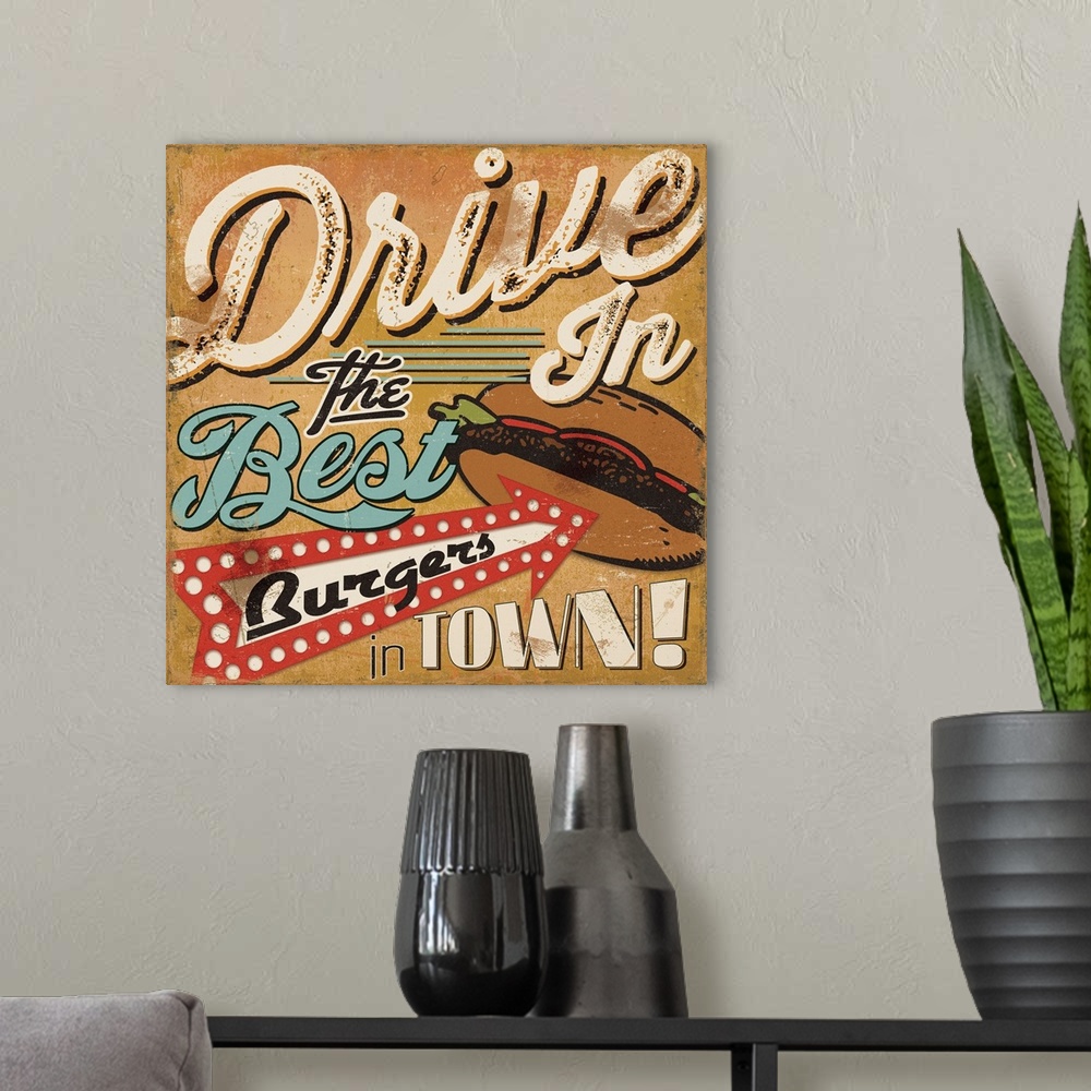 A modern room featuring Retro style sign for a drive in, with an arrow pointing to a burger.