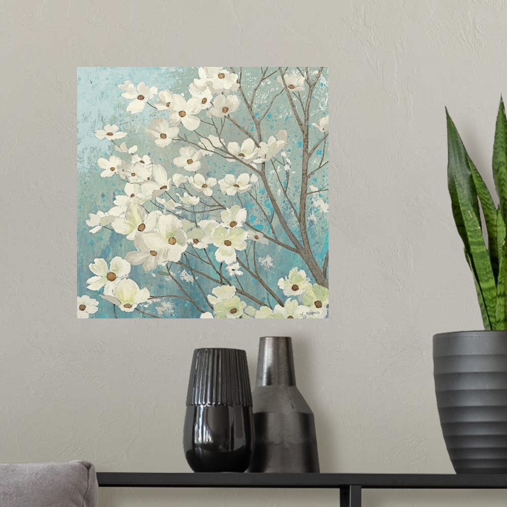 A modern room featuring Painting of flower filled tree branches.